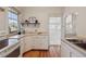 Functional kitchen featuring classic cabinetry, hardwood floors and an open view at 1111 S Corona St, Denver, CO 80210