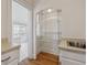 Pantry with white wire shelving and views of the nearby room and window at 1111 S Corona St, Denver, CO 80210