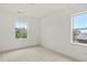 Bright and airy bedroom with large windows offering pleasant neighborhood views at 9566 Poppy Way, Arvada, CO 80007