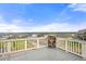 Outdoor deck boasting scenic neighborhood views and a sturdy railing for a secure and enjoyable outdoor experience at 9566 Poppy Way, Arvada, CO 80007