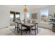 Dining room with sliding door access to the outdoor deck and backyard views at 9566 Poppy Way, Arvada, CO 80007