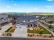 Beautiful two-story home featuring a three-car garage, well-manicured lawn, professional landscaping, and a picturesque view at 9566 Poppy Way, Arvada, CO 80007