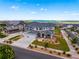 An aerial view of a home highlighting its three-car garage, landscaped yard, and location within a neighborhood at 9566 Poppy Way, Arvada, CO 80007