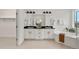 Spa-like bathroom with dual sinks, black granite countertops, soaking tub, and a walk-in shower at 9566 Poppy Way, Arvada, CO 80007