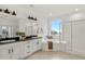 Bright and modern bathroom with a double vanity, soaking tub, shower and views of the neighborhood at 9566 Poppy Way, Arvada, CO 80007