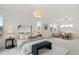 Spacious main bedroom featuring neutral colors, a seating area, and lots of natural light at 9566 Poppy Way, Arvada, CO 80007