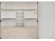 Spacious walk-in closet with built-in shelving and ample storage space at 9566 Poppy Way, Arvada, CO 80007