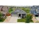 An aerial view of the home showcasing its position in the neighborhood with surrounding houses and greenery at 11817 Phoebe St, Parker, CO 80134