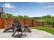 Serene backyard featuring a patio with outdoor seating, lush greenery, and a scenic view at 11817 Phoebe St, Parker, CO 80134