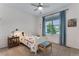 Bright bedroom featuring a ceiling fan, ample natural light, and cheerful, colorful decor that will love at 11817 Phoebe St, Parker, CO 80134