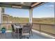 Enjoy outdoor living on this covered patio with ceiling fans and views of the open landscape at 11817 Phoebe St, Parker, CO 80134