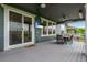 Relaxing covered patio features outdoor seating, ceiling fans, and scenic views at 11817 Phoebe St, Parker, CO 80134