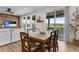 Bright dining room featuring hardwood floors, natural light, and sliding door to the outside at 11817 Phoebe St, Parker, CO 80134