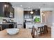 Well-appointed kitchen boasts dark cabinets, granite counters, and stainless steel appliances at 11817 Phoebe St, Parker, CO 80134