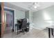 Light-filled room with wood-look floors offering space for a home office setup at 15492 E Floyd Ave, Aurora, CO 80013