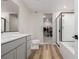 This primary bathroom has a walk-in shower, soaking tub, and walk-in closet at 17847 E 95Th Ave, Commerce City, CO 80022