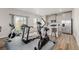 Versatile space with workout equipment, a modern kitchen, and access to outdoor views at 17847 E 95Th Ave, Commerce City, CO 80022