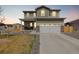Charming two-story home with a two-car garage, covered porch, and well-maintained lawn at 17847 E 95Th Ave, Commerce City, CO 80022