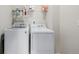 Laundry room featuring a large washer and dryer set at 17847 E 95Th Ave, Commerce City, CO 80022