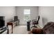 The carpeted room features an office setup with a desk and a chair at 17847 E 95Th Ave, Commerce City, CO 80022