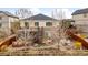 Backyard features a stone facade, deck, and patio at 6031 S Irvington Ct, Aurora, CO 80016