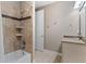Bathroom featuring a shower over tub, a single vanity, and tile flooring at 6031 S Irvington Ct, Aurora, CO 80016