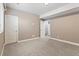 The bedroom features neutral colored walls and carpet with trim throughout at 6031 S Irvington Ct, Aurora, CO 80016