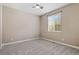 Bedroom featuring neutral walls, carpet, a ceiling fan, and natural light from a window at 6031 S Irvington Ct, Aurora, CO 80016