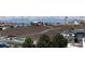 Scenic view of the new community featuring a park with walking paths and landscaped surroundings and the snow-capped mountains in the distance at 6031 S Irvington Ct, Aurora, CO 80016