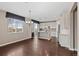 Spacious kitchen with island, white cabinets, and adjacent dining area at 6031 S Irvington Ct, Aurora, CO 80016