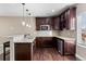 Features a granite countertop, stainless steel appliances and dark wood cabinetry at 6031 S Irvington Ct, Aurora, CO 80016