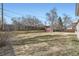 Large backyard with a wooden fence, providing privacy and a serene outdoor space for relaxation and recreation at 709 S Alkire St, Lakewood, CO 80228