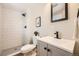 Modern bathroom featuring a tiled shower, updated fixtures, and a sleek vanity for a contemporary look at 709 S Alkire St, Lakewood, CO 80228
