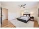 Bright bedroom featuring hardwood floors, neutral walls, ceiling fan and soft, cozy rug at 709 S Alkire St, Lakewood, CO 80228