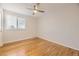 Bright and airy bedroom with hardwood floors and a ceiling fan at 709 S Alkire St, Lakewood, CO 80228