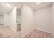 Well-lit hallway with wood-look flooring, offering seamless transition between rooms and inviting ambiance at 709 S Alkire St, Lakewood, CO 80228
