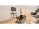 Comfortable living room with modern decor, including a sleek TV, stylish furniture, and an open concept layout at 709 S Alkire St, Lakewood, CO 80228