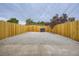 Spacious gravel backyard surrounded by a wooden fence providing privacy and a low-maintenance outdoor space at 3656 Fairfax St, Denver, CO 80207