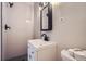 Modern bathroom featuring a sleek vanity, black fixtures, subway tile shower, and patterned flooring at 3656 Fairfax St, Denver, CO 80207