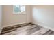 Bedroom featuring hardwood floors, natural light, and a minimalist design at 3656 Fairfax St, Denver, CO 80207