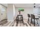 Dining area with modern table and chairs, and an adjacent bar top with stool seating at 3656 Fairfax St, Denver, CO 80207