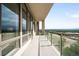 A large balcony with glass railings offers panoramic views of the surrounding landscape at 7600 Landmark Way # 904, Greenwood Village, CO 80111