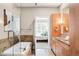 Modern bathroom boasting a soaking tub, glass shower, dual vanity, and wooden cabinets at 7600 Landmark Way # 904, Greenwood Village, CO 80111