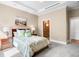 Relaxing bedroom showcasing a decorative bed, accent pillows, and cozy, neutral colors at 7600 Landmark Way # 904, Greenwood Village, CO 80111