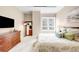 Comfortable bedroom features a plush bed, city views from the window, and a flat-screen TV at 7600 Landmark Way # 904, Greenwood Village, CO 80111