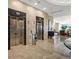 Modern elevators with marble trim, stainless steel doors, and a glimpse of the elegant lobby at 7600 Landmark Way # 904, Greenwood Village, CO 80111