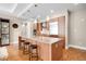 Spacious kitchen island with granite counters, stainless steel appliances, and modern pendant lighting at 7600 Landmark Way # 904, Greenwood Village, CO 80111