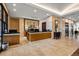 Elegant lobby reception area with marble floors, wood reception desks, and stylish decor at 7600 Landmark Way # 904, Greenwood Village, CO 80111