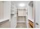 Well-organized walk-in closet with built-in shelving, drawers, and ample storage space at 7600 Landmark Way # 904, Greenwood Village, CO 80111