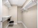 Simple walk-in closet with shelving, a small desk, and chair to help keep your clothes organized at 7600 Landmark Way # 904, Greenwood Village, CO 80111
